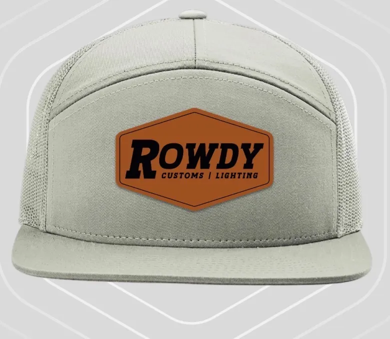Light grey seven-panel cap with matching mesh side panels and a leather Rowdy Customs patch.