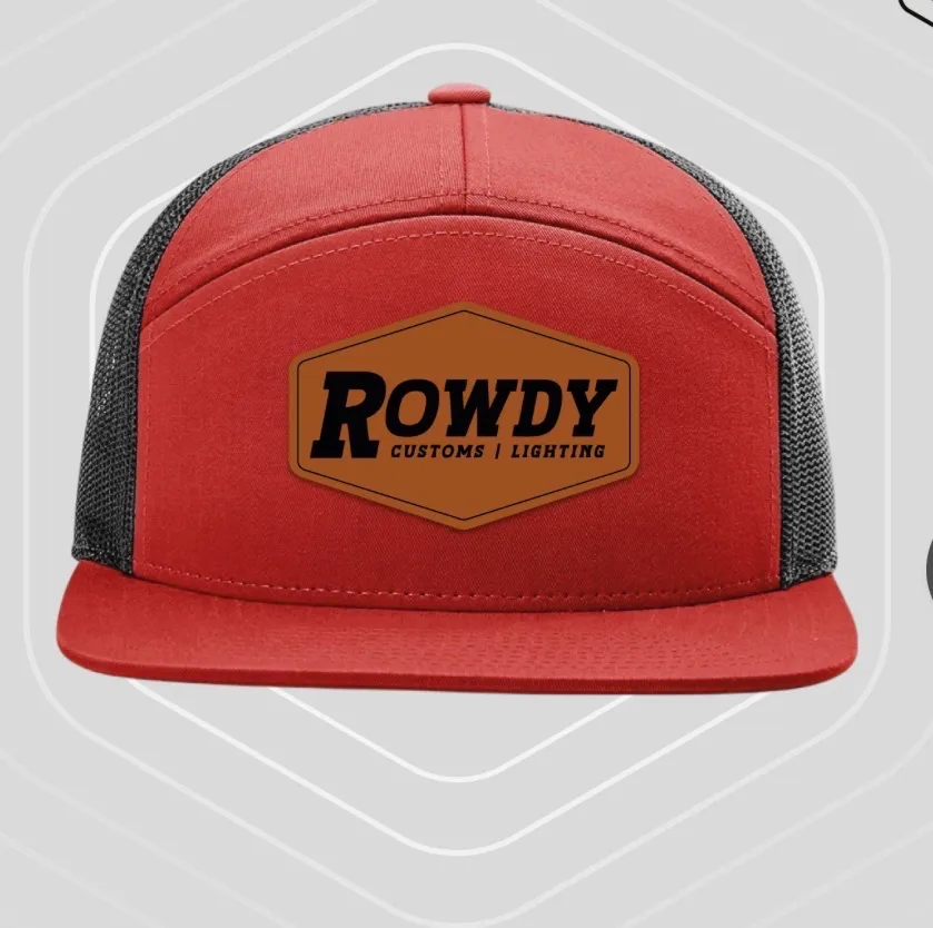 Red seven-panel cap with black mesh side panels and a leather patch carrying the Rowdy Customs wordmark.