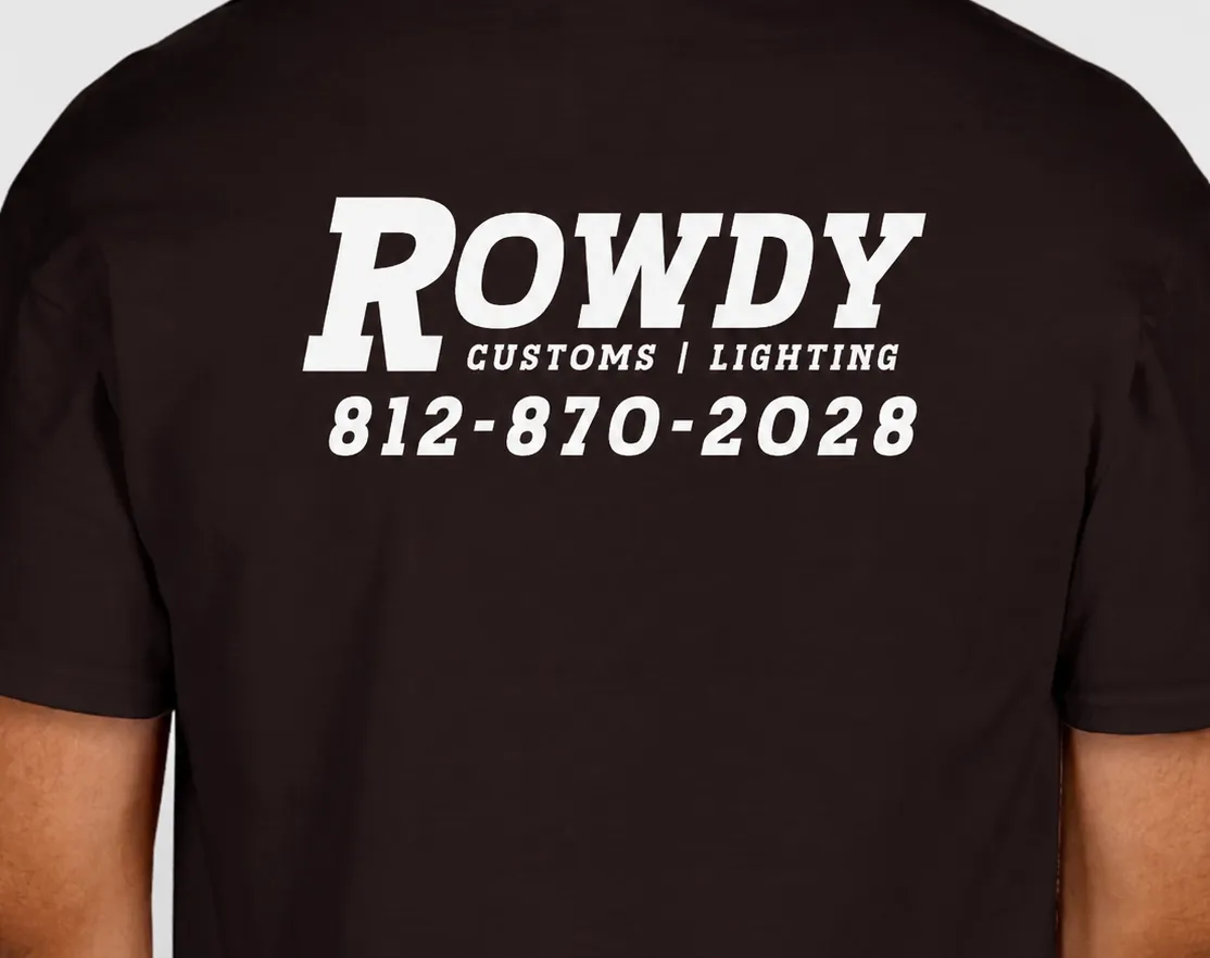 Dark brown t-shirt worn, back view, with the Rowdy Customs wordmark and phone number printed large in white.
